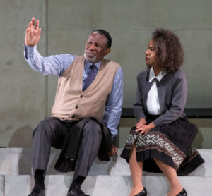 Man and woman sitting on the stairs.